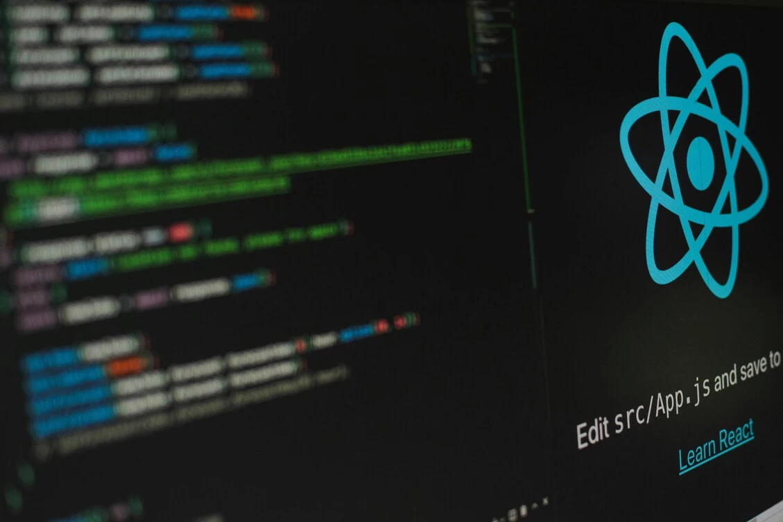Developer writing code on laptop